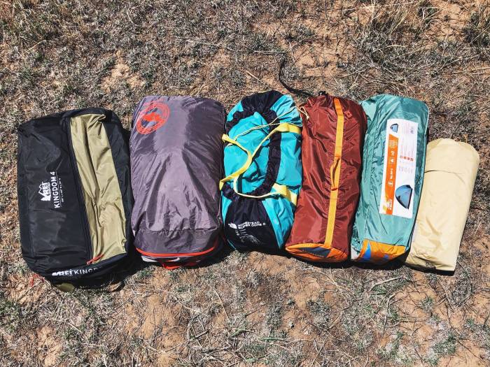 Camping Tents Stuff Sacks Arranged on Ground